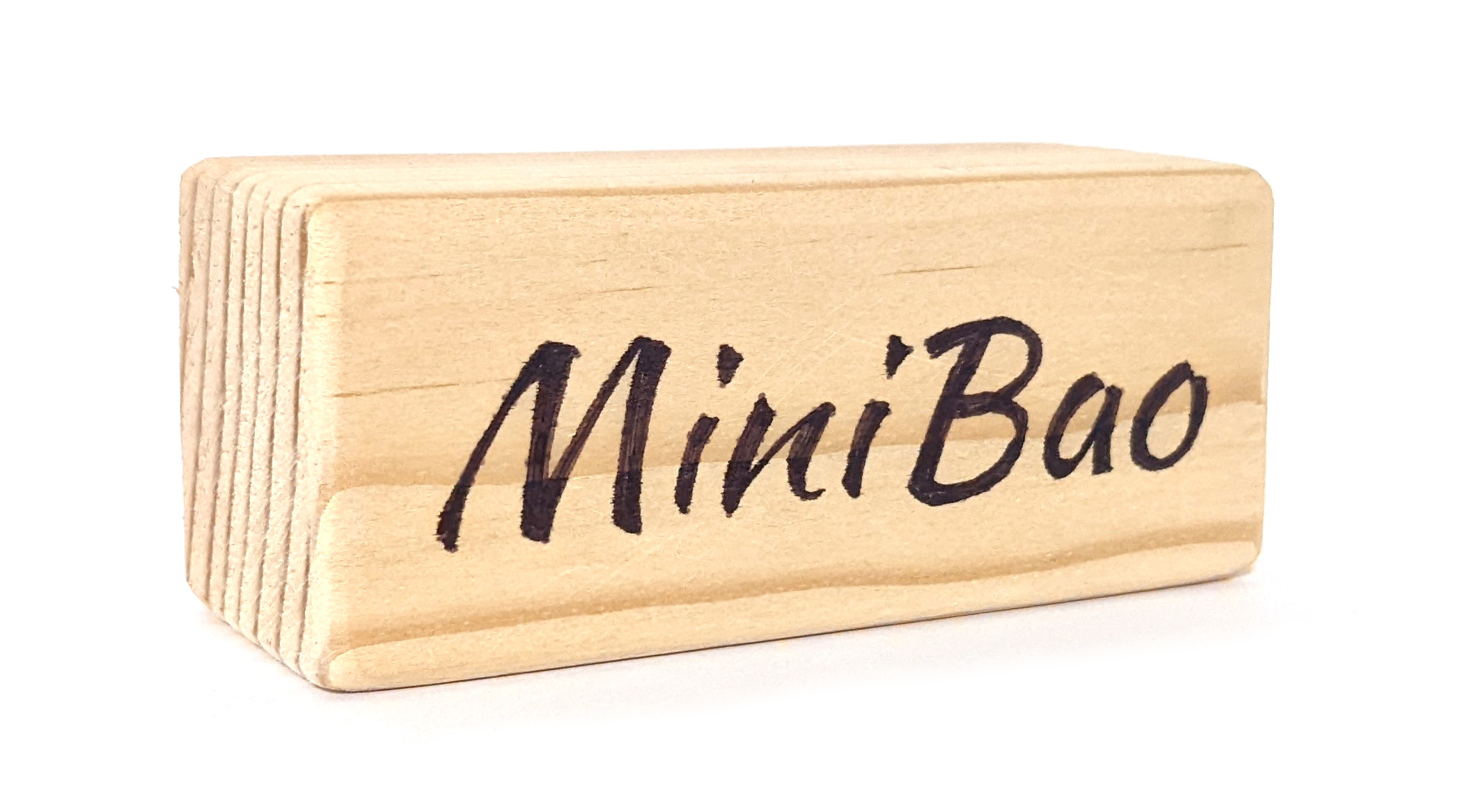 A wooden block with 'MiniBao' written on it